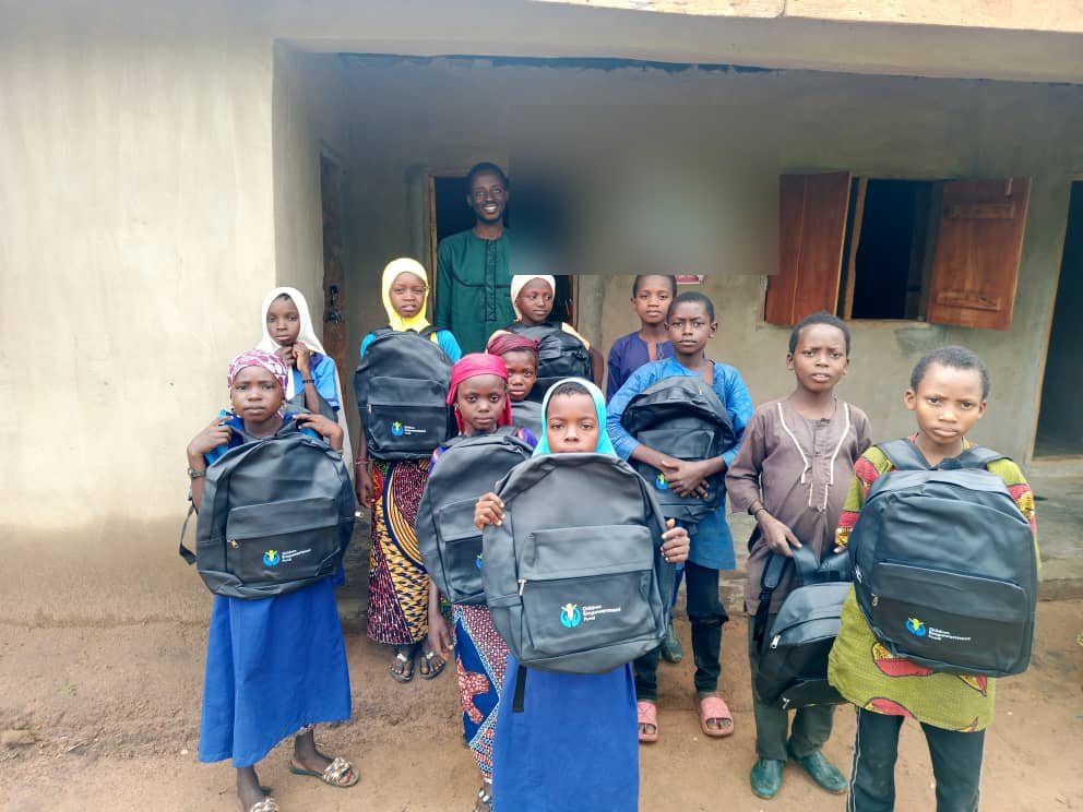 Girls receiving school bags through Phynai's Bridge a Girl to School project