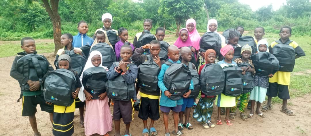 Children with school bags provided through Phynai's education support